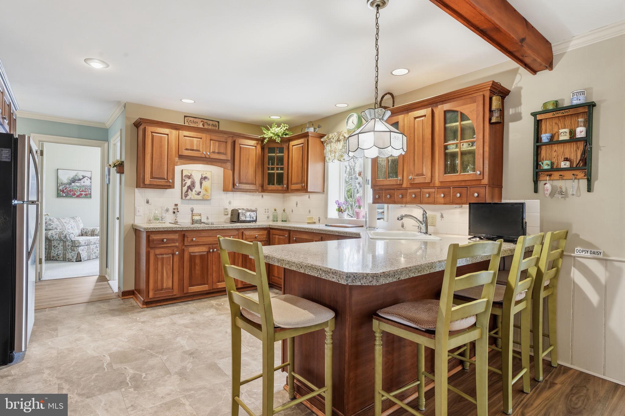 211 Longview Avenue Langhorne, PA 19047 - Photo 17 of 62 a kitchen with a table chairs sink and cabinets