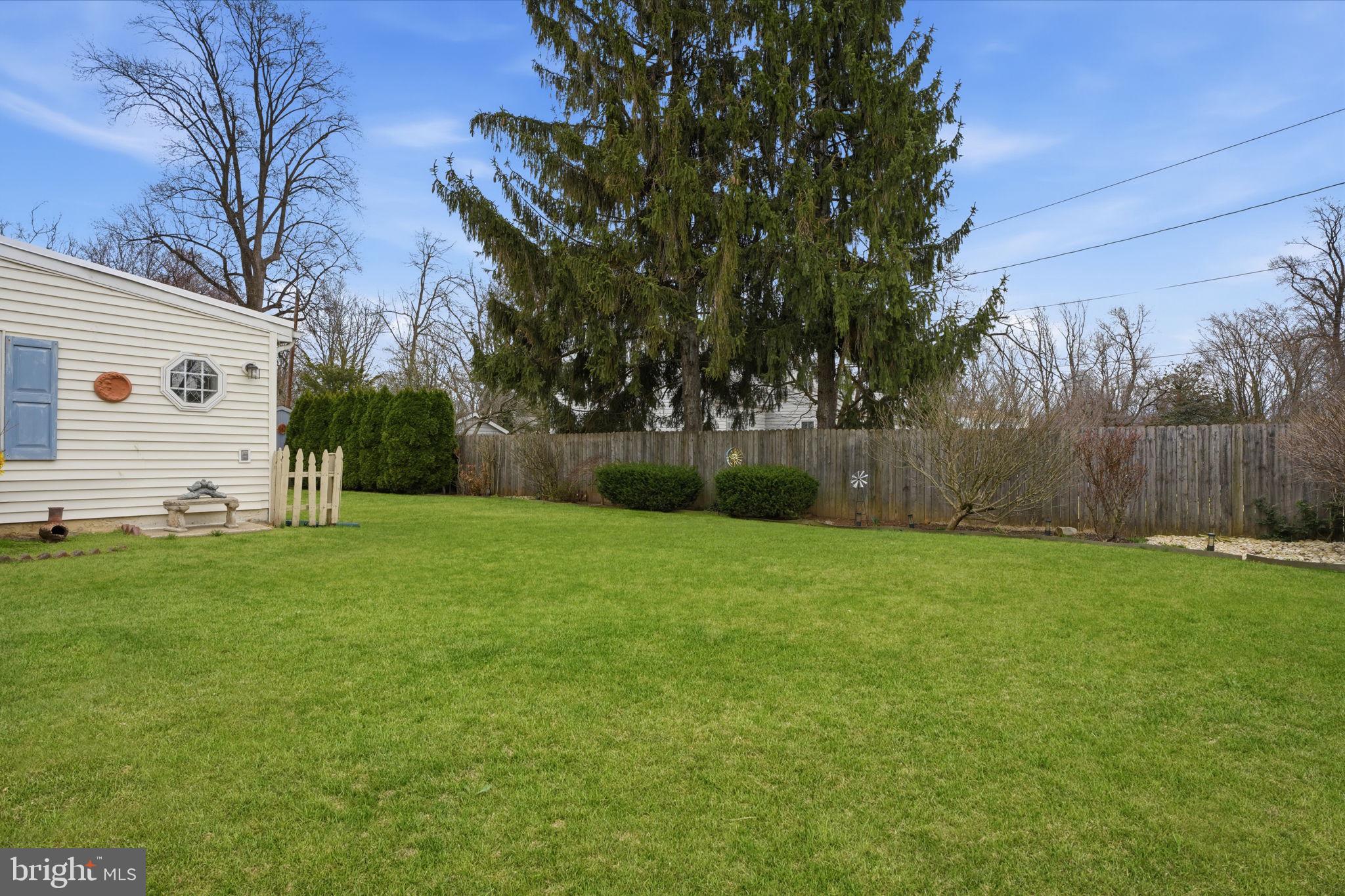211 Longview Avenue Langhorne, PA 19047 - Photo 47 of 62 a view of a backyard with a garden and entertaining space