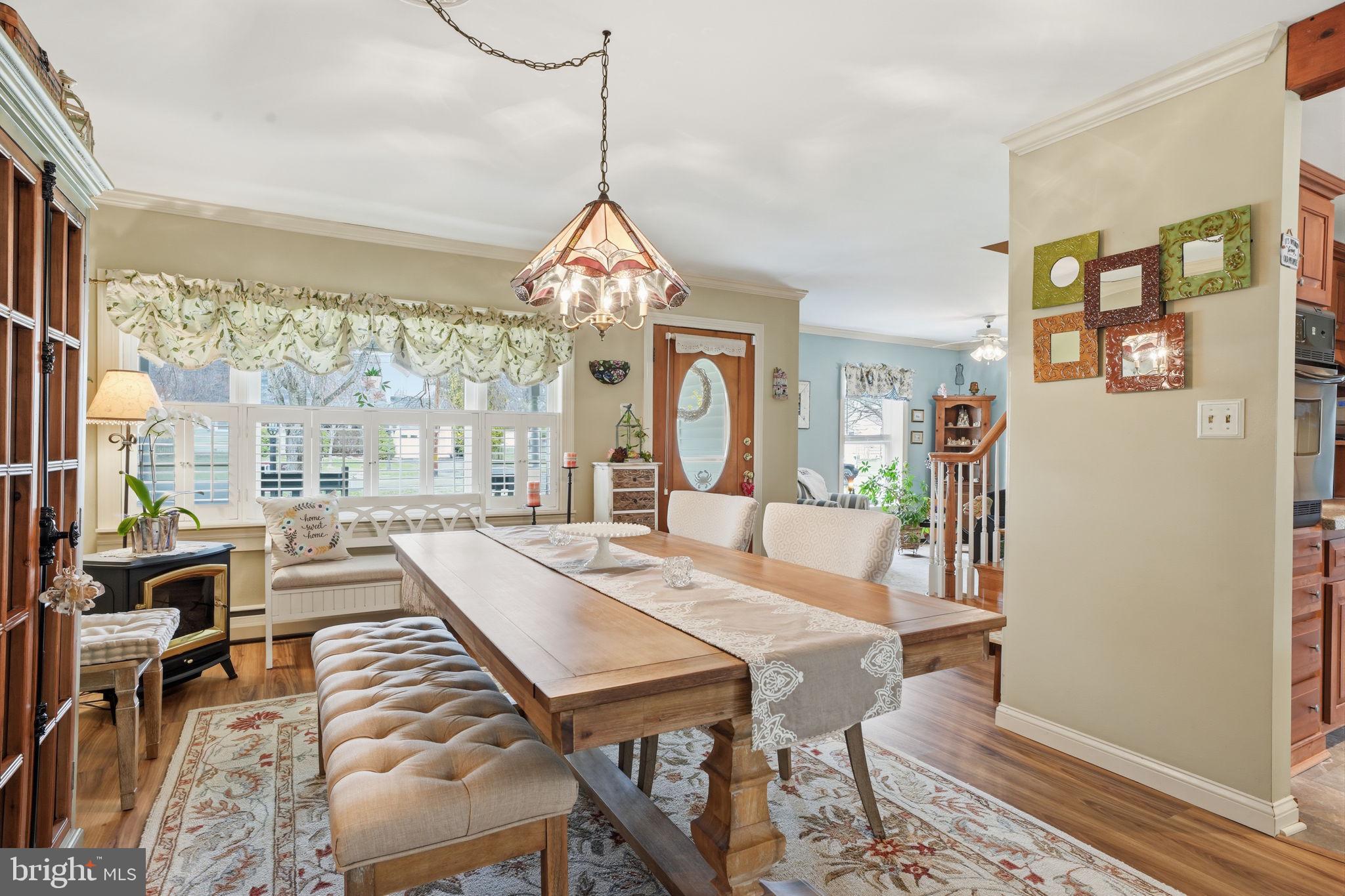 211 Longview Avenue Langhorne, PA 19047 - Photo 5 of 62 a view of a dining room and livingroom with furniture wooden floor a chandelier