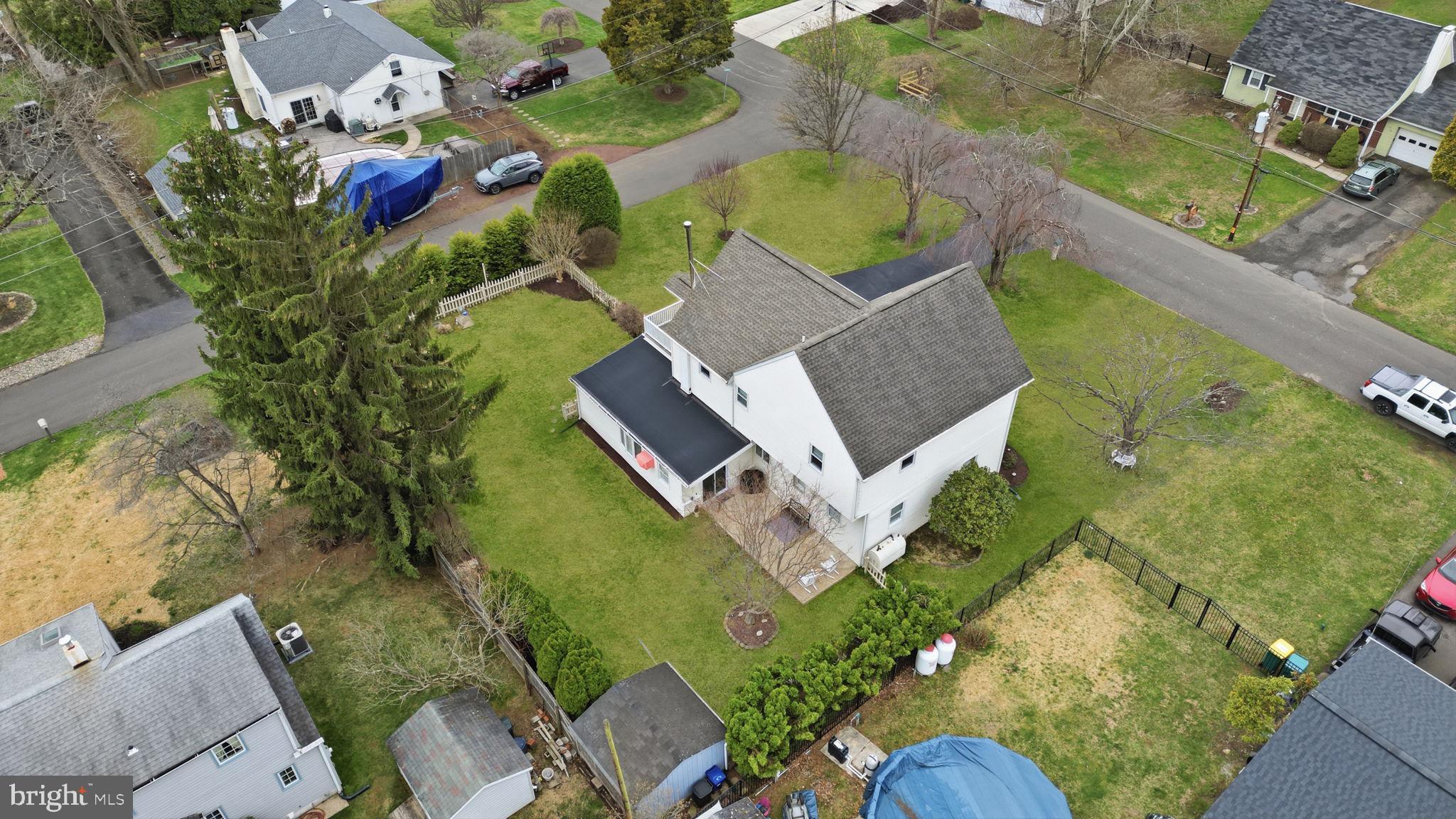 211 Longview Avenue Langhorne, PA 19047 - Photo 52 of 62 an aerial view of a house with a swimming pool