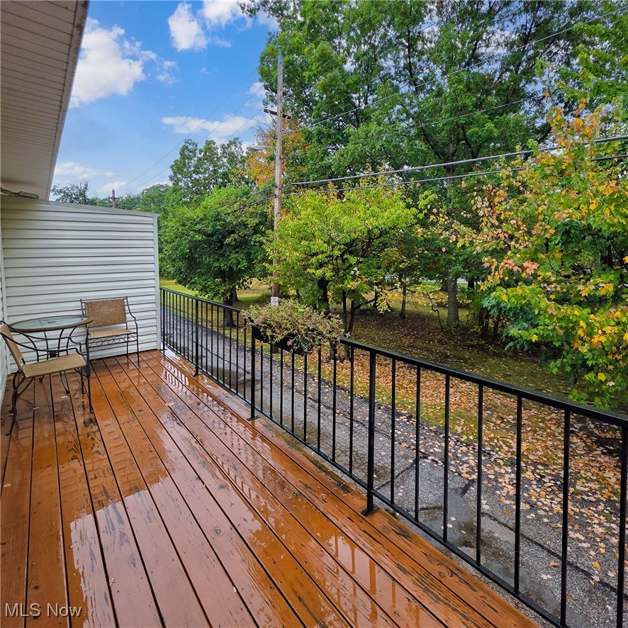 6474 State Road, Unit I10 Parma, OH 44134 - Photo 13 of 31 Deck featuring view of wooded area