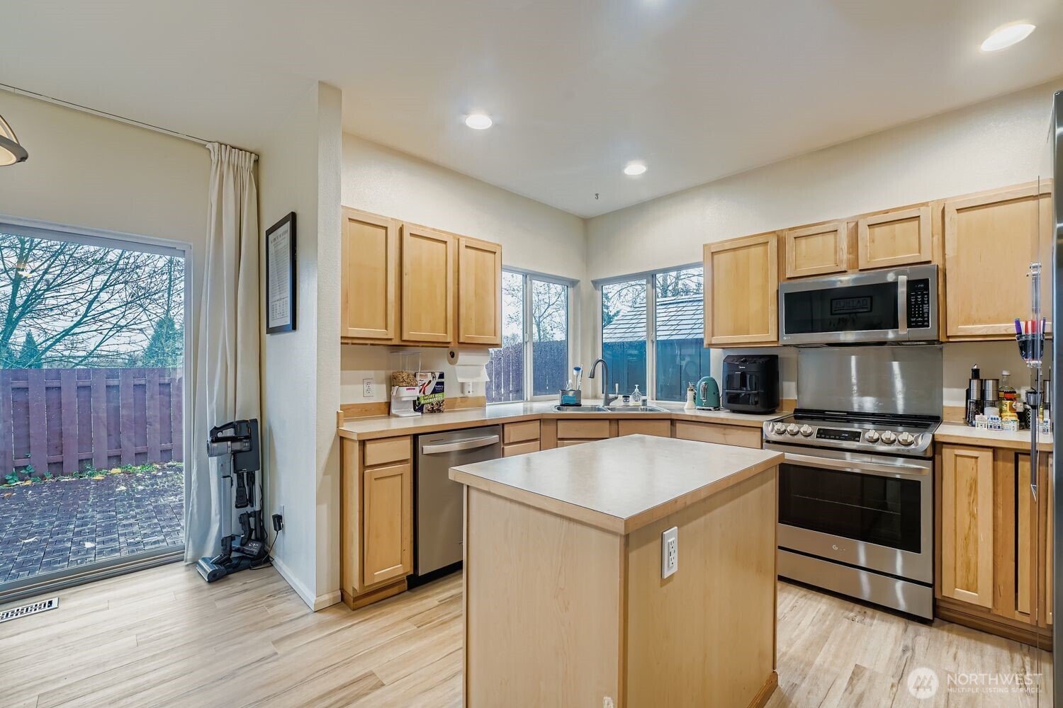 4109 South 220th Place, Unit 18 Kent, WA 98032 - Photo 14 of 29 a kitchen with a sink stove and refrigerator