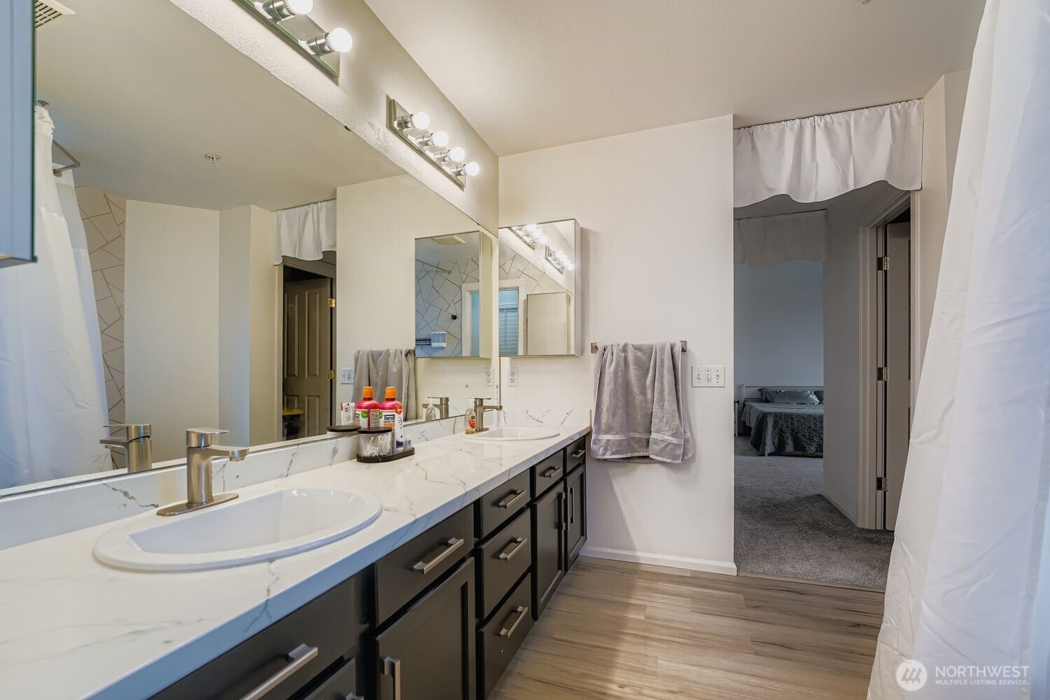 4109 South 220th Place, Unit 18 Kent, WA 98032 - Photo 19 of 29 a bathroom with a sink double vanity and a mirror