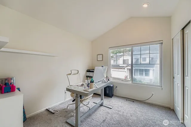 a workspace with furniture and a window