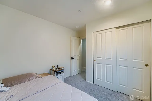 a room that has a bed and a closet in it