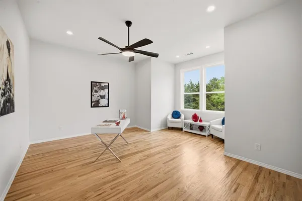 a view of a livingroom with a window and couch