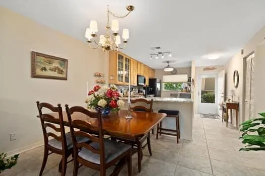 a living room with furniture a lamp and a flat screen tv