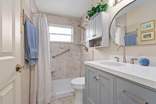 1351 Bayshore Drive, Unit 101 Fort Pierce, FL 34949 - Photo 24 of 37 a bathroom with a sink a toilet and shower