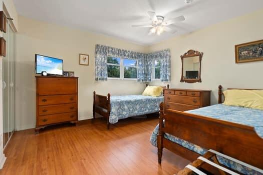 1351 Bayshore Drive, Unit 101 Fort Pierce, FL 34949 - Photo 25 of 37 a bedroom with a bed and furniture