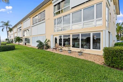 1351 Bayshore Drive, Unit 101 Fort Pierce, FL 34949 - Photo 28 of 37 a house view with a garden space