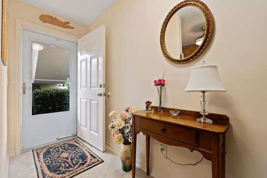 1351 Bayshore Drive, Unit 101 Fort Pierce, FL 34949 - Photo 6 of 37 a bathroom with a toilet a sink and a mirror