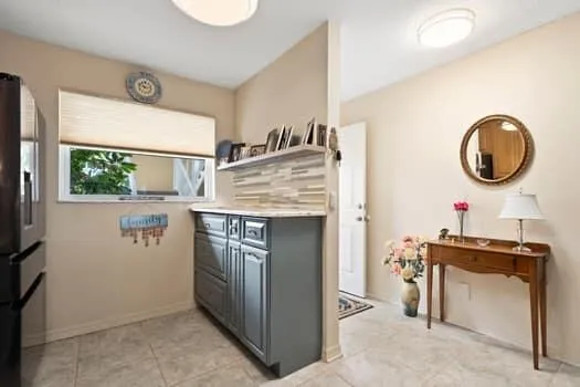 a kitchen with stainless steel appliances granite countertop a stove a sink dishwasher a refrigerator and a microwave oven