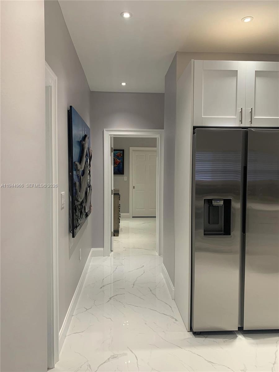 63 Bass Avenue, Unit 1 Key Largo, FL 33037 - Photo 4 of 9 a view of a hallway with an entryway