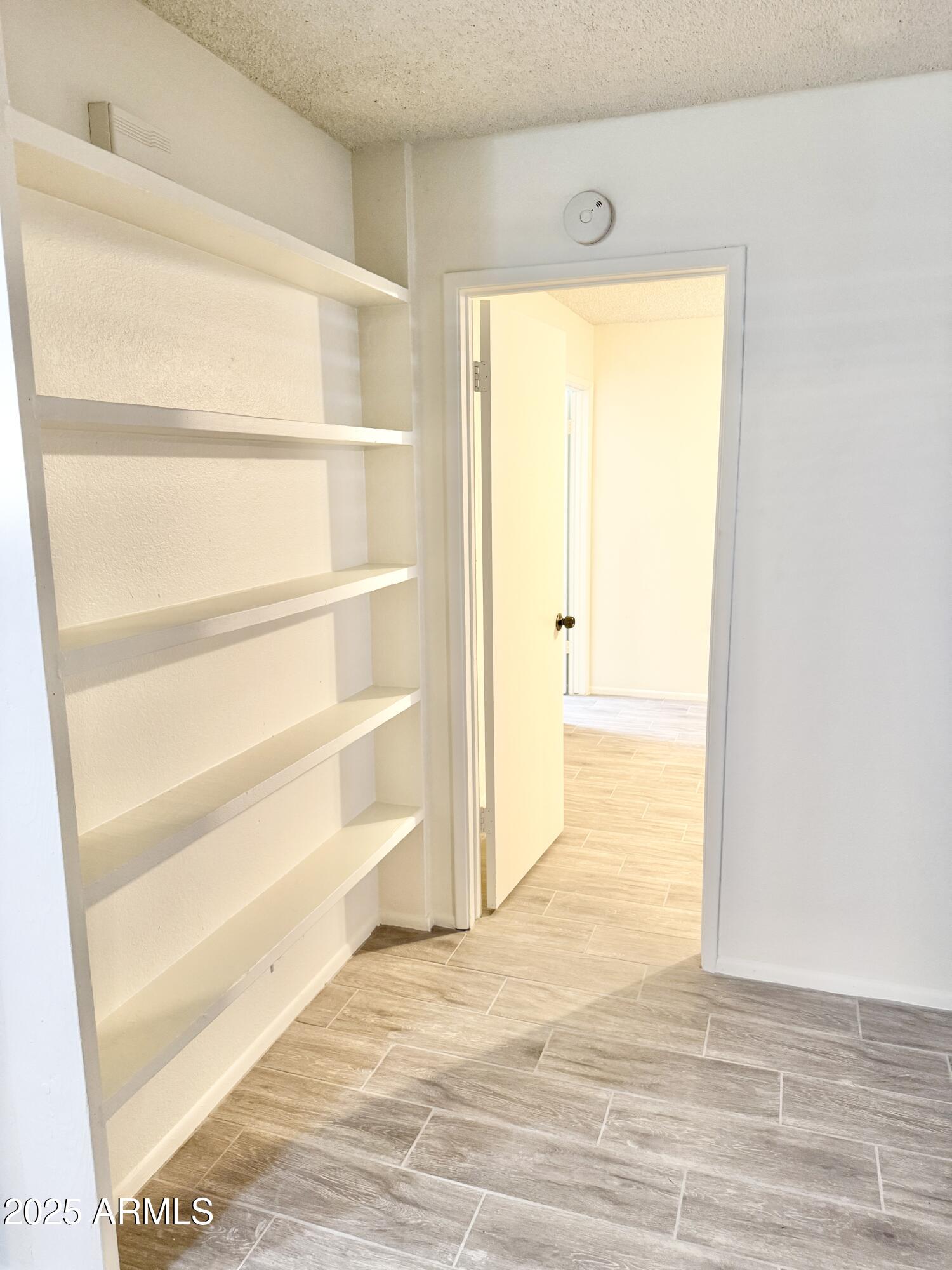 9015 West Elm Street, Unit 2 Phoenix, AZ 85037 - Photo 11 of 32 a view of a room with an empty space