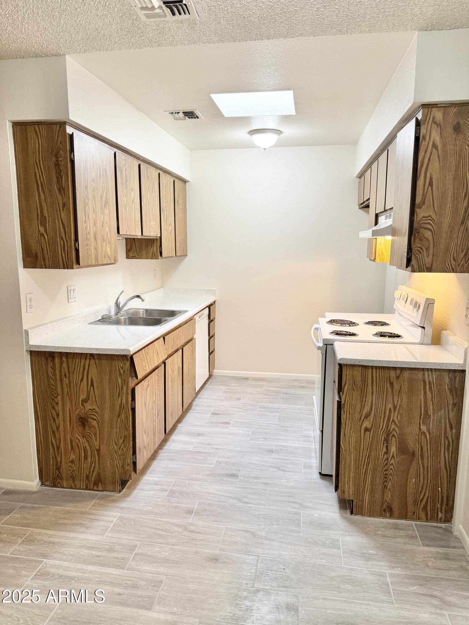 9015 West Elm Street, Unit 2 Phoenix, AZ 85037 - Photo 6 of 32 a bathroom with a sink and a mirror