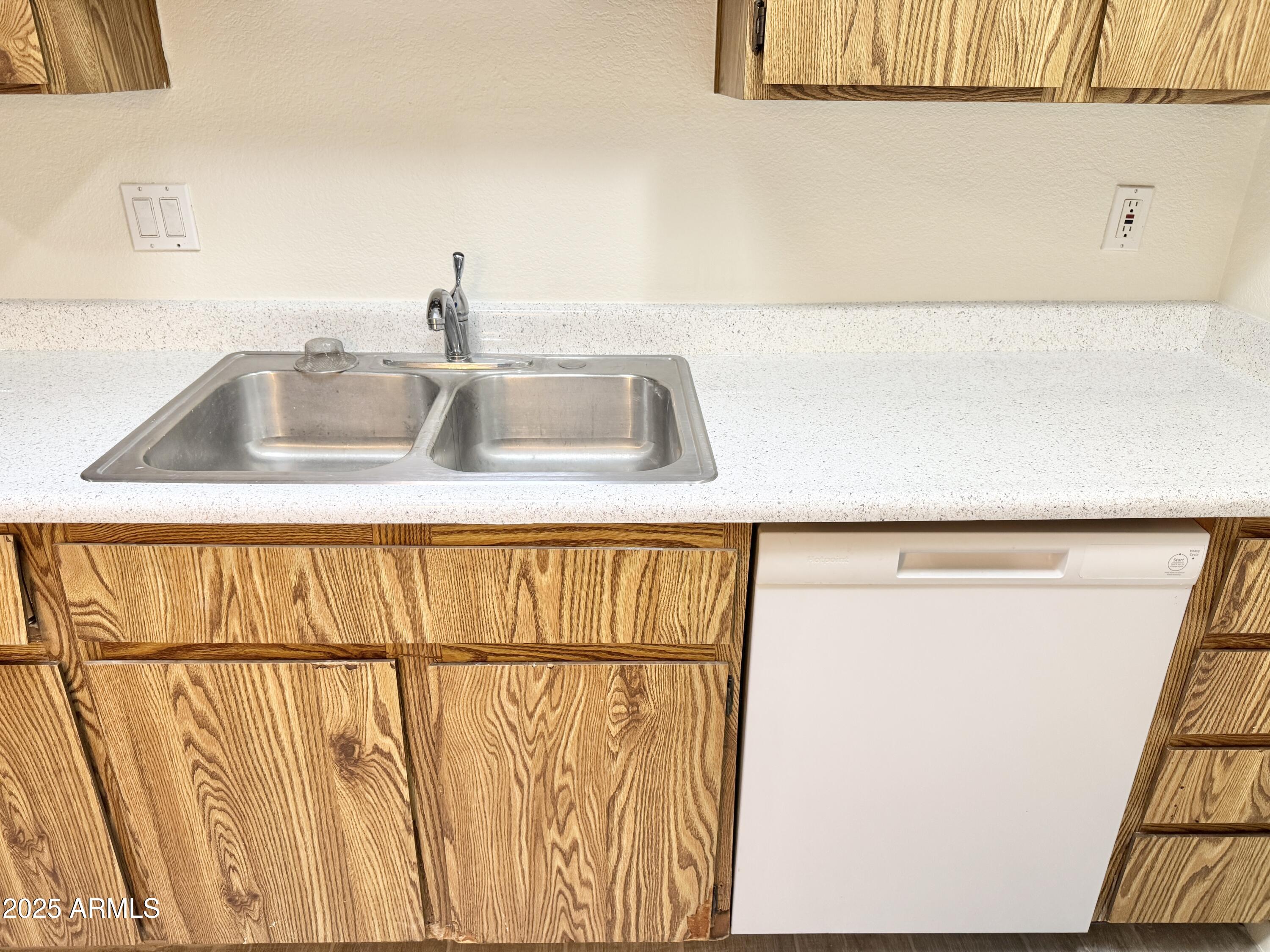 9015 West Elm Street, Unit 2 Phoenix, AZ 85037 - Photo 9 of 32 a close view of sink and tap