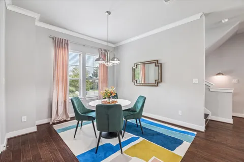 a view of a kitchen with a table and chairs