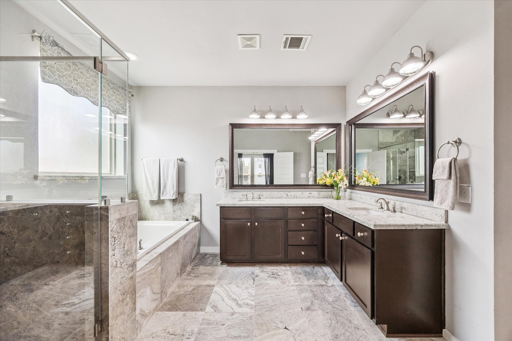 1702 Shearn Street Houston, TX 77007 - Photo 19 of 31 Getting ready will be a breeze with two vanities and plenty of counter space. To the right, you’ll find a water closet and a huge walk-in closet!