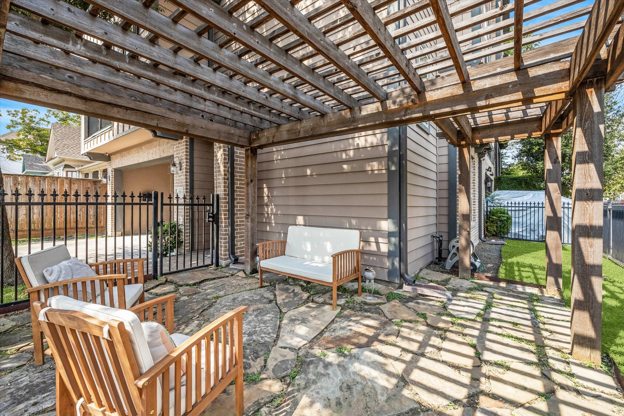 1702 Shearn Street Houston, TX 77007 - Photo 26 of 31 Enjoy this charming courtyard, perfect for relaxing outdoors or entertaining guests.