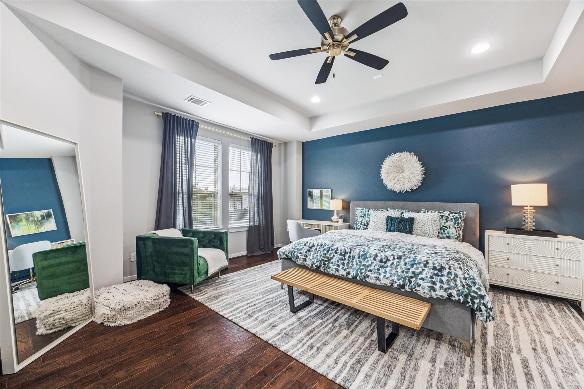 1702 Shearn Street Houston, TX 77007 - Photo 4 of 31 Huge primary suite featuring hardwood floors, a tray ceiling, recessed lighting, an accent wall.