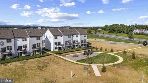 a swimming pool with outdoor seating and yard