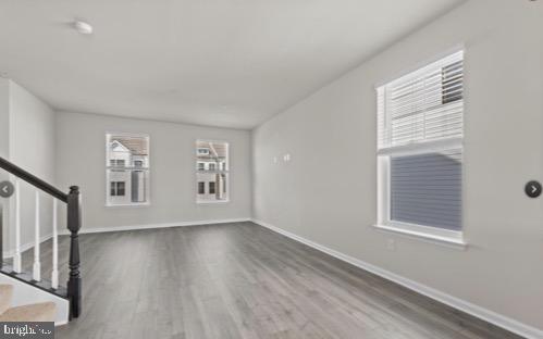 329 Ensemble Way Frederick, MD 21701 - Photo 5 of 20 a view of an empty room with wooden floor and a window