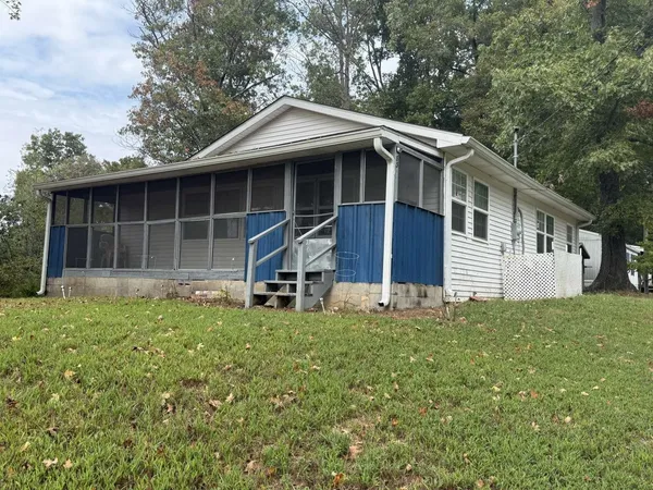 a house with trees in the background