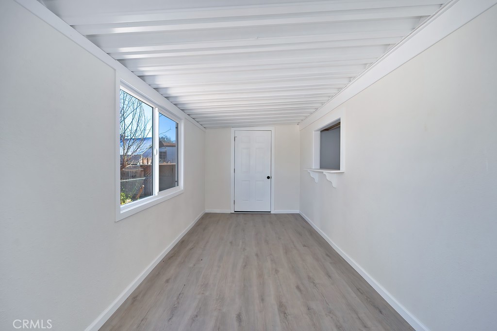 26455 Paradise Valley Road, Unit 85 Warner Springs, CA 92086 - Photo 11 of 36 a view of empty room with wooden floor and fan