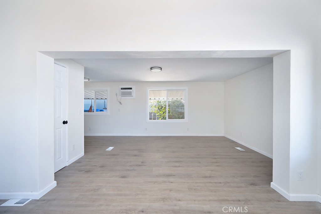 26455 Paradise Valley Road, Unit 85 Warner Springs, CA 92086 - Photo 15 of 36 a view of an empty room with wooden floor and a window
