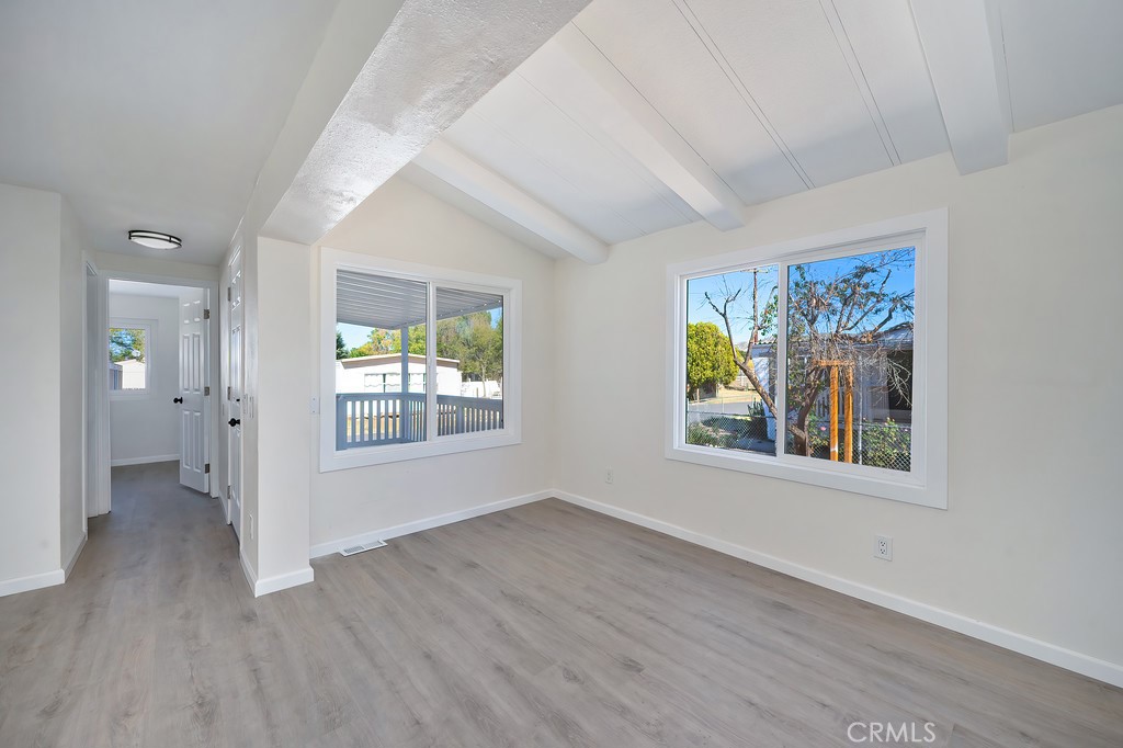 26455 Paradise Valley Road, Unit 85 Warner Springs, CA 92086 - Photo 16 of 36 wooden floor in an empty room with a window