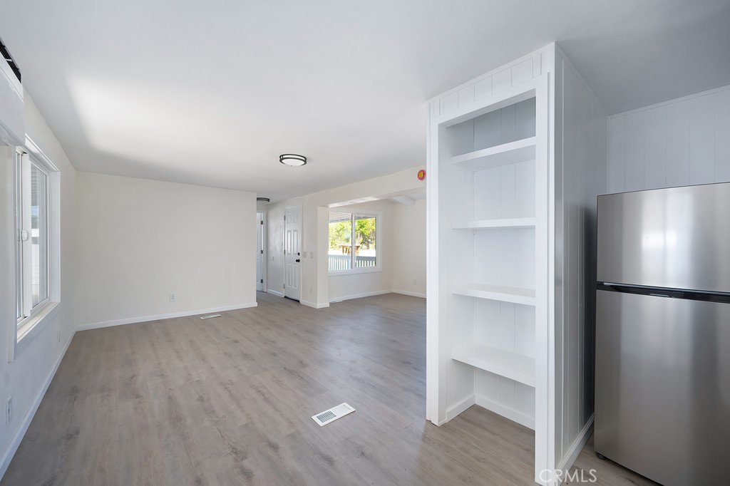 26455 Paradise Valley Road, Unit 85 Warner Springs, CA 92086 - Photo 17 of 36 a view of an empty room with a window and wooden floor