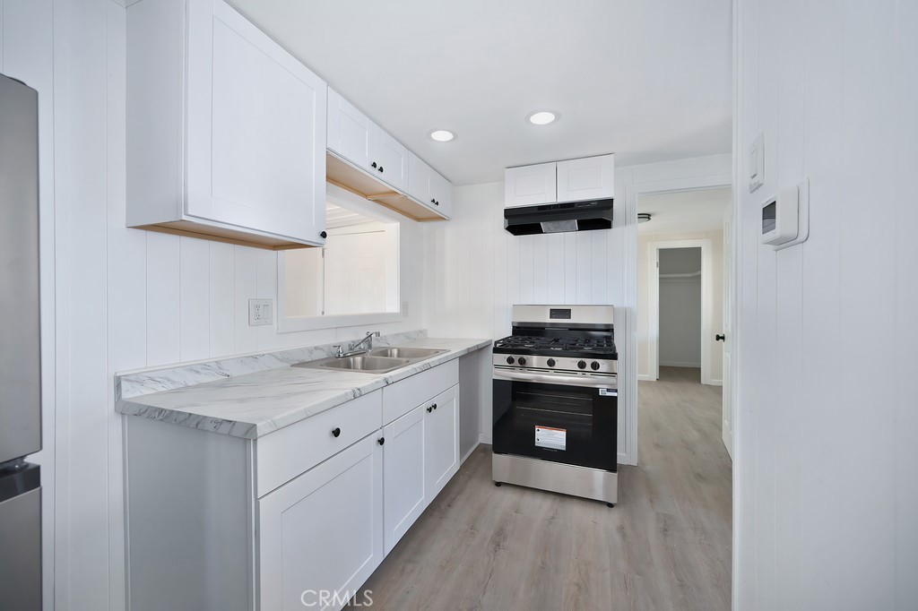 26455 Paradise Valley Road, Unit 85 Warner Springs, CA 92086 - Photo 18 of 36 a kitchen with stainless steel appliances granite countertop a stove and a sink