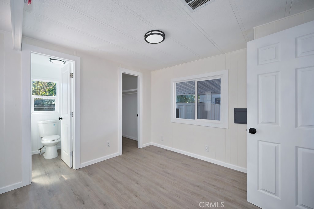 26455 Paradise Valley Road, Unit 85 Warner Springs, CA 92086 - Photo 23 of 36 a view of an empty room with a window and wooden floor