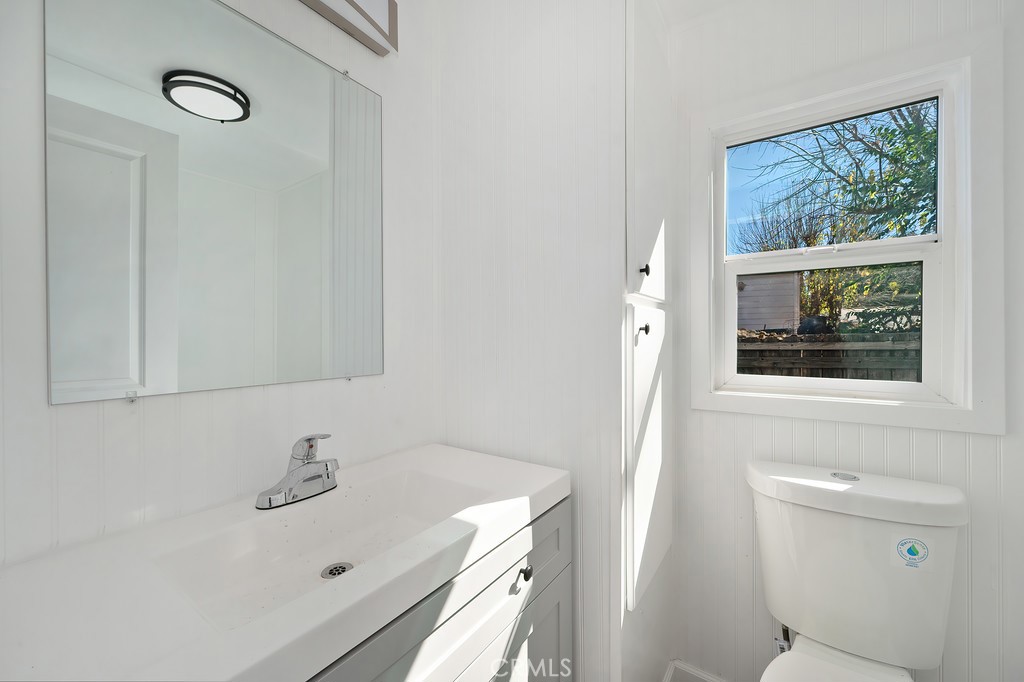 26455 Paradise Valley Road, Unit 85 Warner Springs, CA 92086 - Photo 26 of 36 a bathroom with a sink a toilet and a mirror