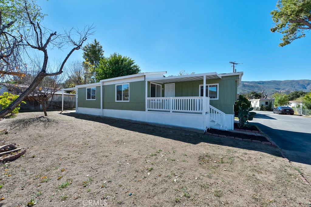 26455 Paradise Valley Road, Unit 85 Warner Springs, CA 92086 - Photo 5 of 36 a front view of a house with a yard