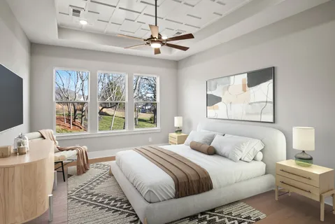 a bedroom with a bed and a couch