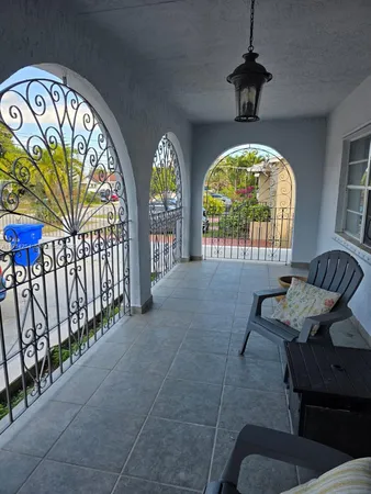 a view of hall way with furniture