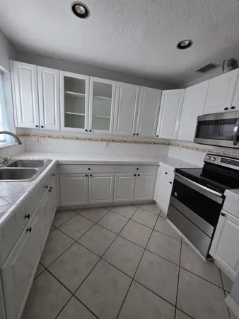 a kitchen with a sink and cabinets