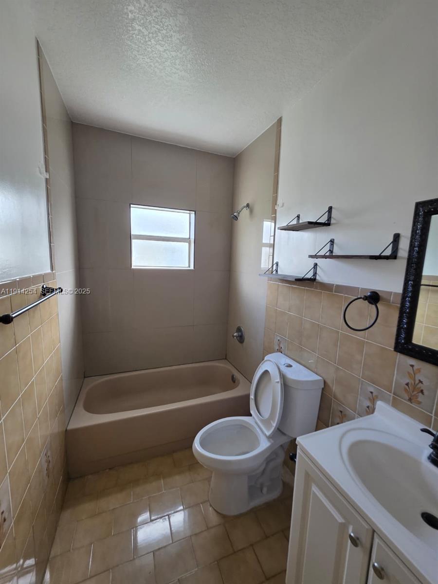 2970 Southwest 17th Street Miami, FL 33145 - Photo 12 of 25 a bathroom with a sink a toilet and a bathtub