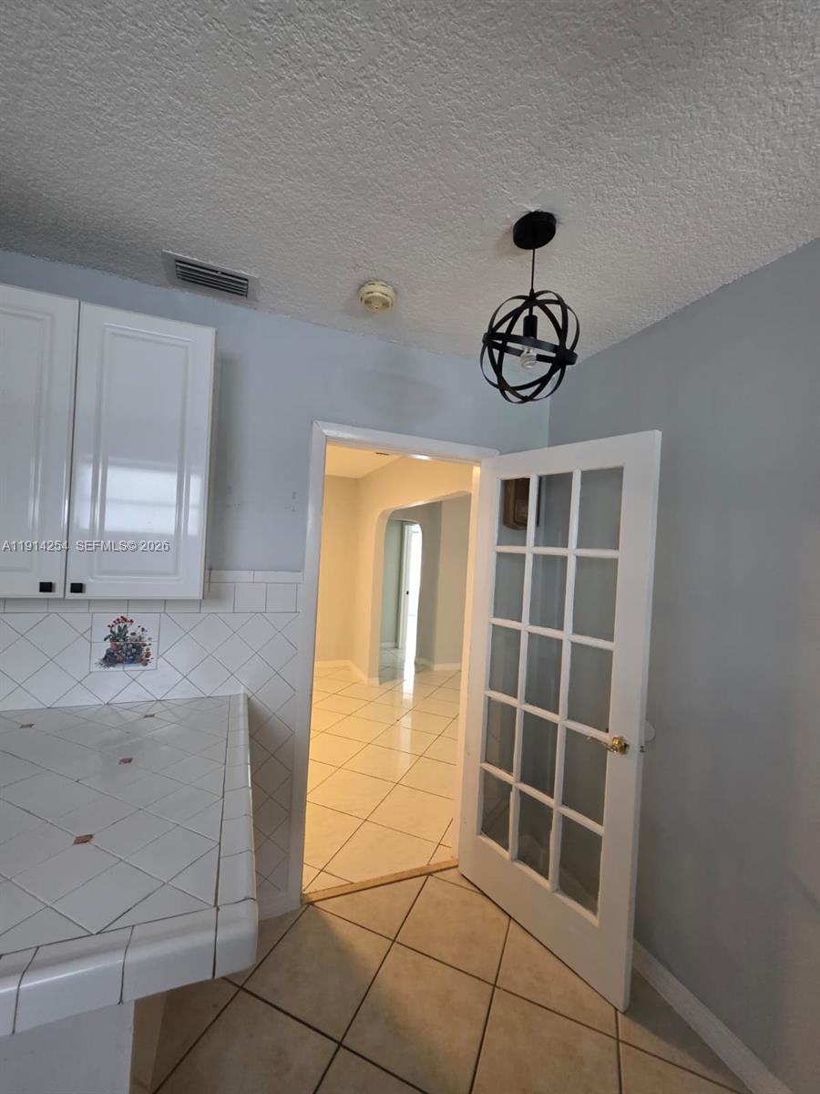 2970 Southwest 17th Street Miami, FL 33145 - Photo 13 of 27 a view of an empty room with a window