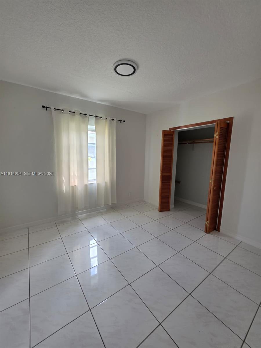 2970 Southwest 17th Street Miami, FL 33145 - Photo 16 of 27 a view of an empty room and window