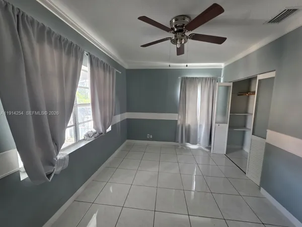 a view of an empty room with a window