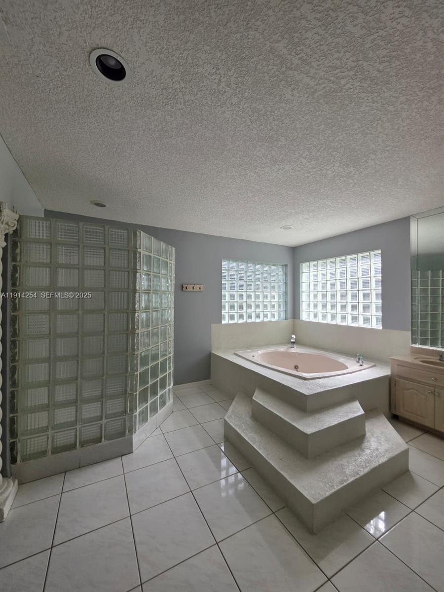2970 Southwest 17th Street Miami, FL 33145 - Photo 20 of 25 a spacious bathroom with a bathtub and window