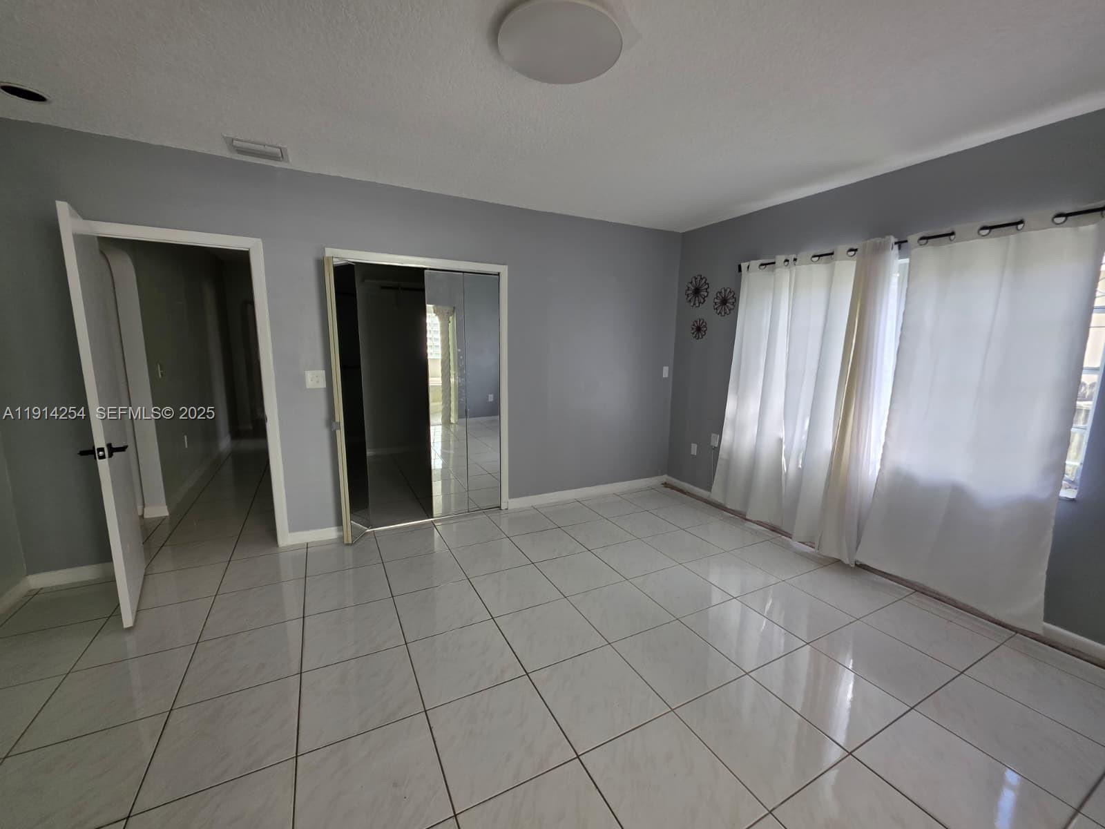 2970 Southwest 17th Street Miami, FL 33145 - Photo 22 of 25 a view of entryway with stairs and a window