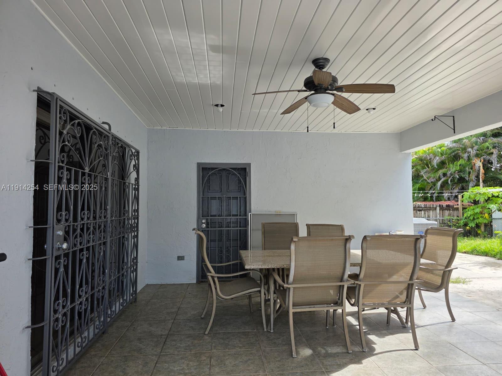 2970 Southwest 17th Street Miami, FL 33145 - Photo 24 of 25 a dining room with furniture and a window