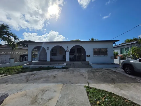 a house view with a backyard space