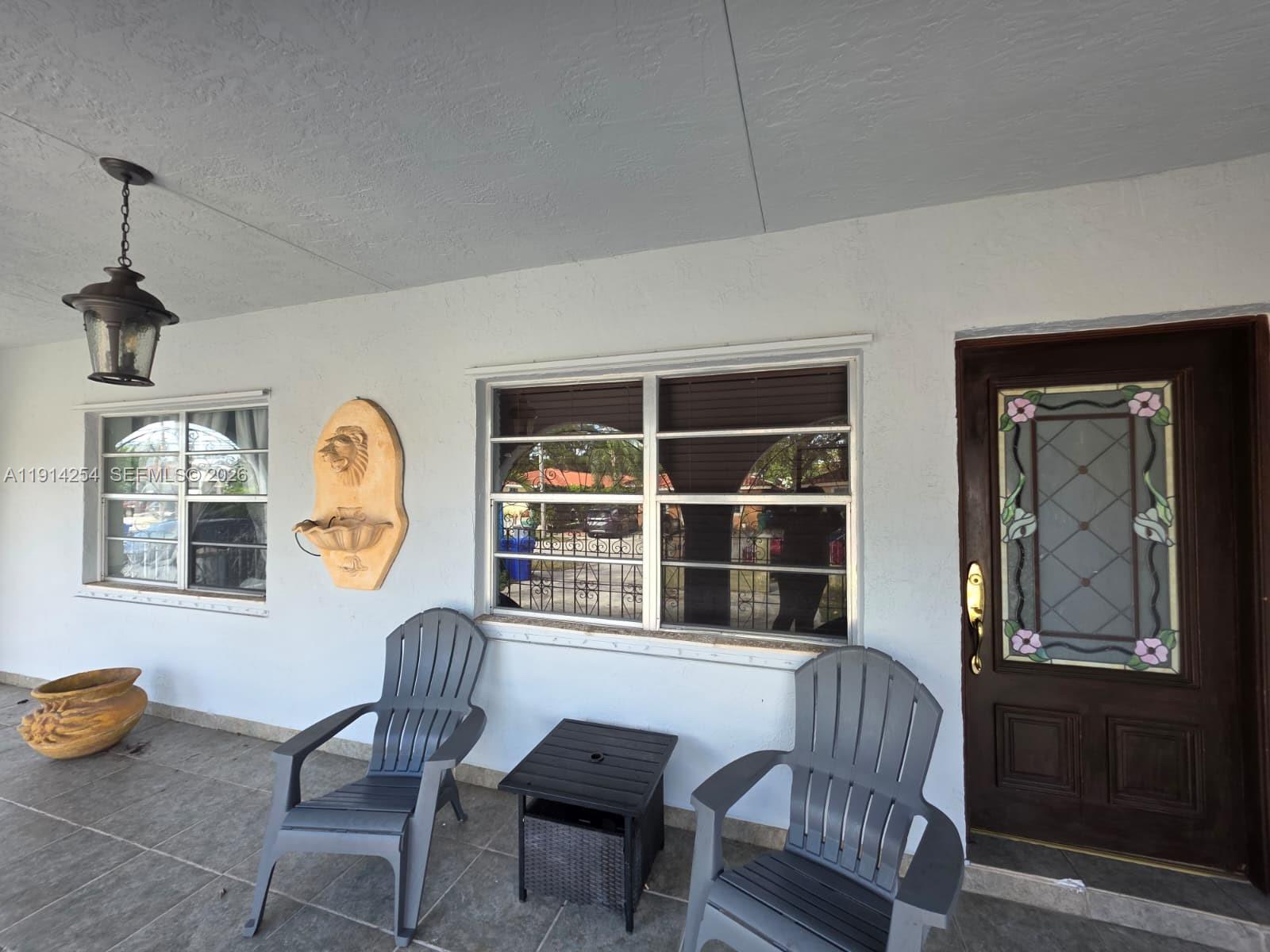 2970 Southwest 17th Street Miami, FL 33145 - Photo 6 of 27 a living room with furniture and a window