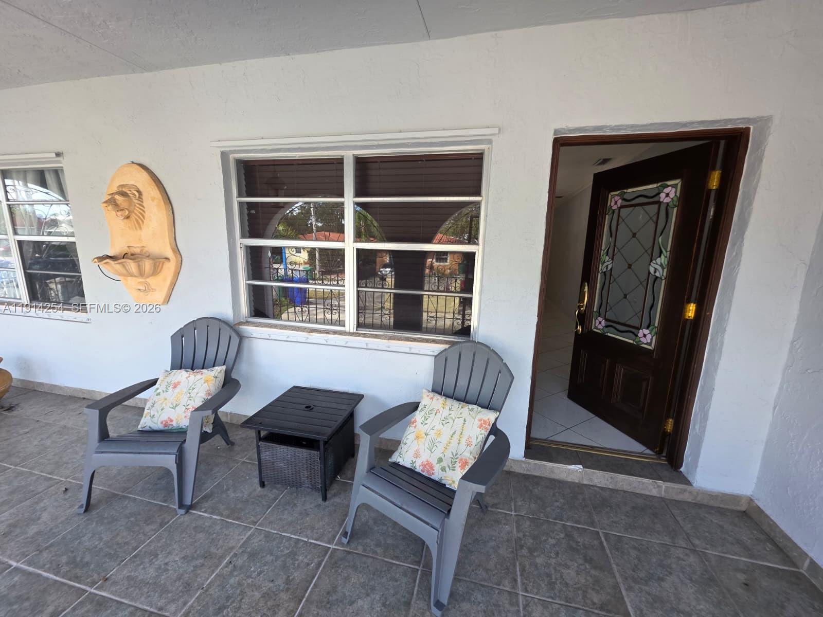 2970 Southwest 17th Street Miami, FL 33145 - Photo 7 of 27 a living room with furniture and a window