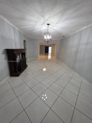 a spacious bathroom with a sink and a mirror