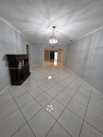 a spacious bathroom with a sink and a mirror